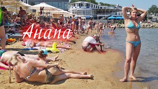 Beach in Russia on the Black sea. Girls and women sunbathe and swim