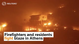 Firefighters and residents fight blaze in Athens