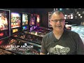 pinball repair and maintenance technician in action at level up arcade