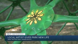 GR artist paints murals on playground equipment