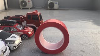 TOY CARS AND CARBOTS SLIDE  PLAY ON RED TAPE