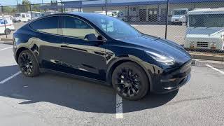 SunTek Glossy Black PPF on a Tesla Model Y Hood