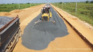 Powerful Construction Dozer Spreading Gravel With Motor Grader Grading And Dump Truck On New Road