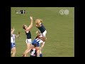 Jeff Farmer takes a screamer in the opening minute of the 1998 Preliminary Final - Melbourne