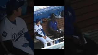 Dodgers Shohei Ohtani, who was chatting, stood up and immediately reacted to a ball coming his way.