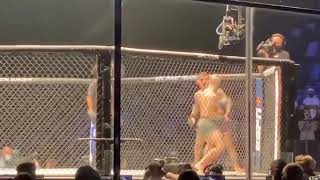 Dustin Poirier finishes Conor McGregor against the cage at UFC 257