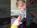 Baby writes his first card on his mom’s birthday with the help from dad. Teach your kids young!