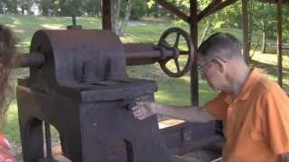 Guy Mathis explains the lathe at the Rome-Floyd Visitor Center