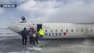 Passengers escape after Delta Airlines plane crashes and flips upside down
