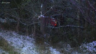 Truck hits black ice and crashes into trees near I-485