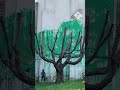 Banksy confirms new tree mural painted on north London flats is his work