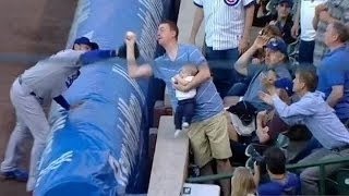 Dad Catches Foul Ball Barehanded While Feeding Baby (VIDEO)