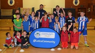 COMMUNITY: Wigan Athletic's Donald Love and Yanic Wildschut at October Soccer School