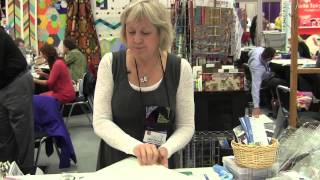 Karla Alexander Demonstrates Rulers at Checker Booth - Spring Quilt Market 2013