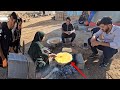 Baking local bread (Berko) by Zahra for breakfast and continue building the house