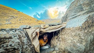 Construction of a wonderful shelter for survival in the mountains. Warm shelter with fireplace