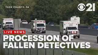 Procession escorts fallen detectives from medical examiner