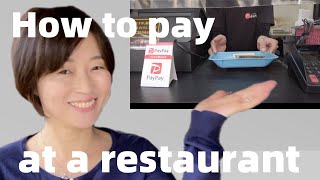 How to pay at a restaurant in Japan