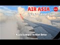 Sky High Journey: AirAsia Flight Through Clouds from Kuala Lumpur to Alor Setar