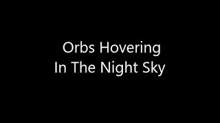 Orbs Hovering in The Night Sky