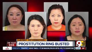 Four charged with prostitution in massage parlor raid
