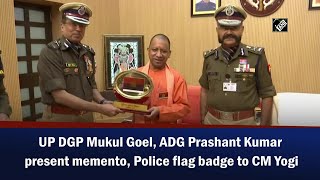 UP DGP Mukul Goel, ADG Prashant Kumar present memento, Police flag badge to CM Yogi