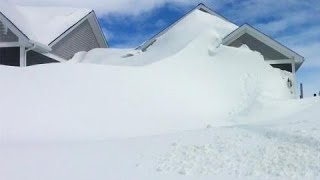 Jaw-dropping amounts of snow cover homes in New Brunswick community, see it