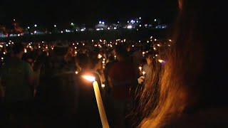 Hundreds at Charlottesville vigil unite against hatred