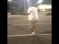 A fat guy dancing in a sexy manner at a parking lot--FUNNNY-