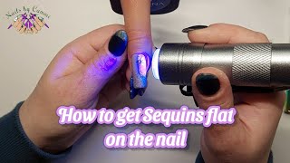 How to get sequins perfectly flat on the nail