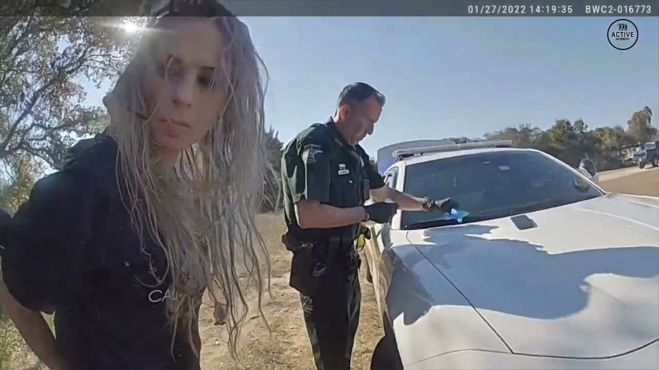 Lady Tries Taking Huge Bag of Drugs from Cop During Search