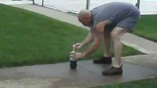 coke and mentos bottle rocket hits cameraman