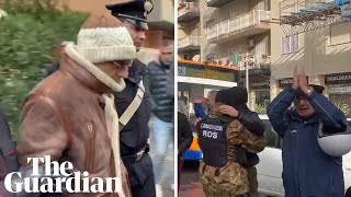 People on the streets cheer as Italy's most-wanted mafia boss is arrested