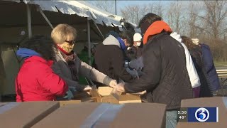 Everyday Heroes: Volunteers distribute food to residents