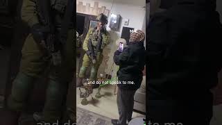 Palestinian woman scolds Israeli soldiers raiding her home as she smokes shisha