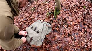 Repairing a Swiss military backpack with leather straps and bottom.