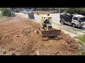 Starting New Project by Bulldozer Komatsu D31PX pushing soil with  Dump Truck