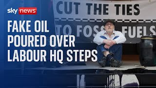 Extinction Rebellion activists pour fake oil over steps of Labour HQ