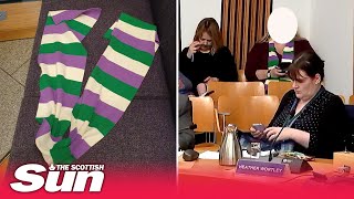 Woman ejected from Holyrood gender bill debate for wearing scarf with suffragette colours