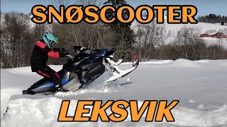 Snøscooter leik i nysnøen