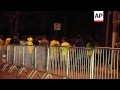 Team buses leaving stadium and Brazil fans show their disappointment