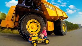 Senya helping daddy fix a broken tractor.
