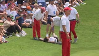 Fan rushes Scottie Scheffler on the green at Byron Nelson, officials take him down