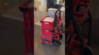 Milwaukee Packout dolly, crates and boxes in use by Fire Alarm tech