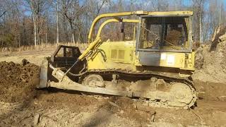 Cat D5 digging a pit