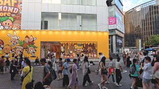 On a scorching Saturday afternoon, Myeongdong is packed with tourists