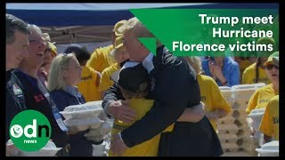 Trump gives hugs and handouts to Hurricane Florence victims