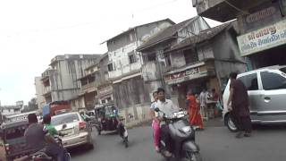 Riding on a motorbike in Navsari Town centre, Gujarat, India; 21st May 2012