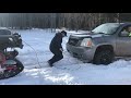 jeep with tracks pulling out a suburban