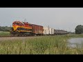 KCS 2821 leads the weed sprayer going by Buffalo, MN